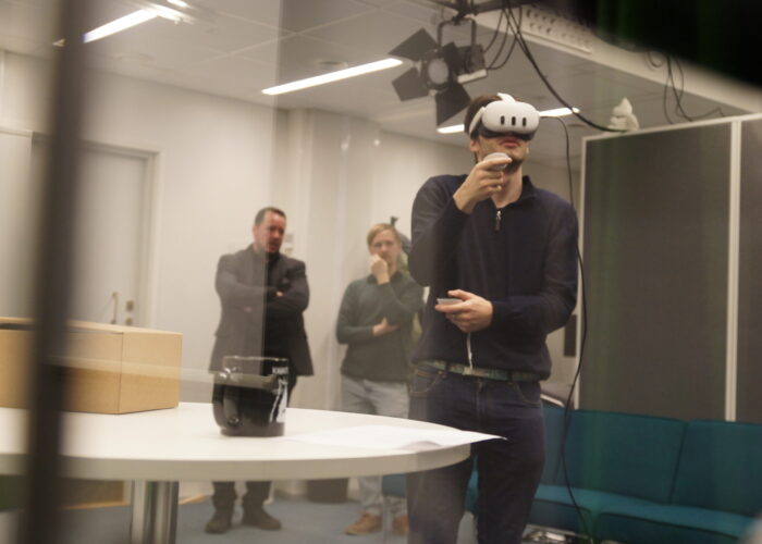 MR researchers testing a VR application